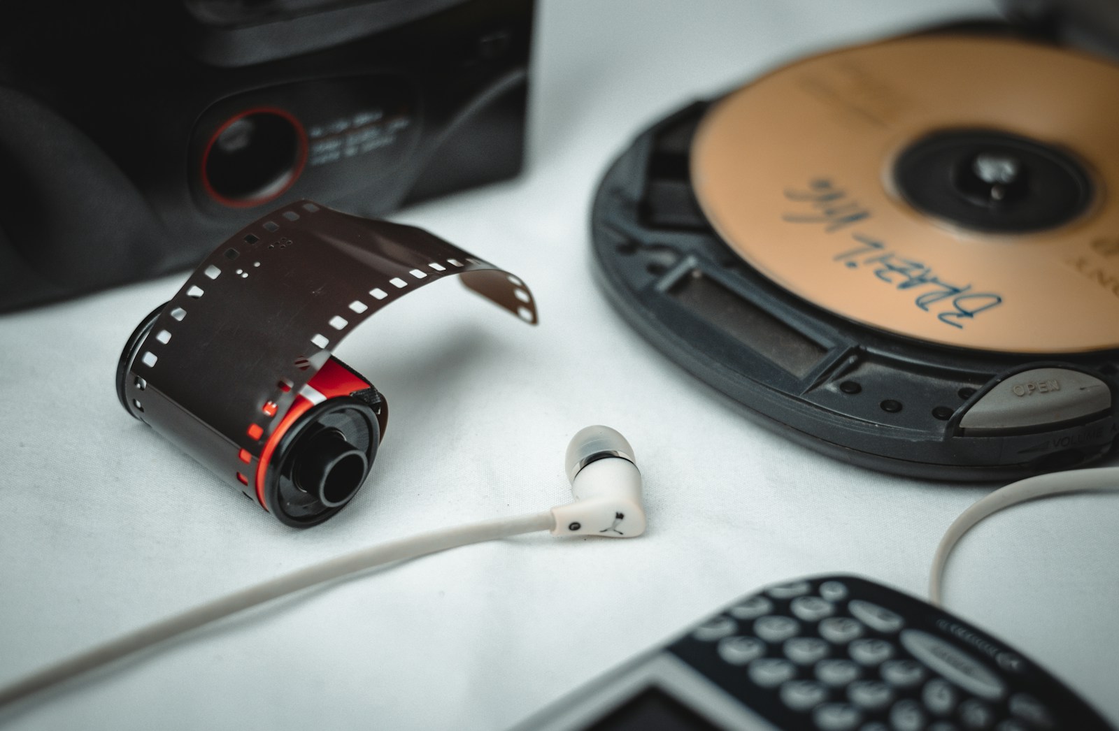 a pair of headphones sitting next to a movie projector